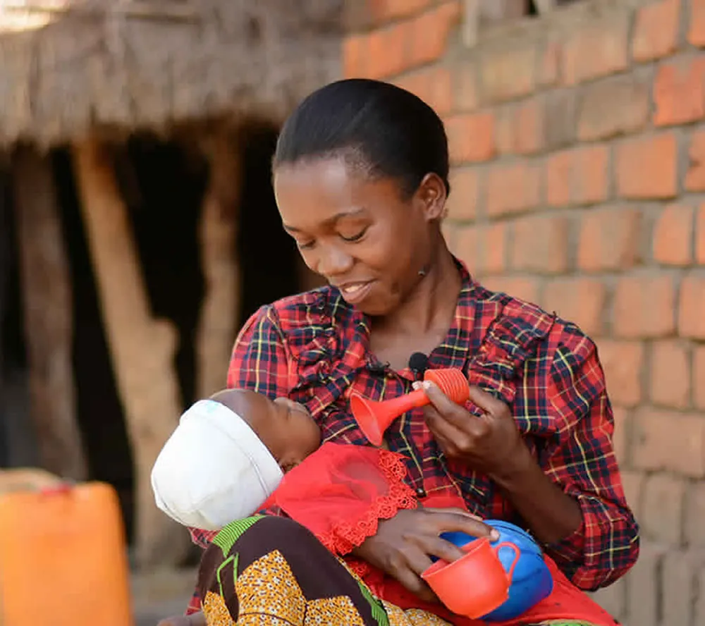 A mother feeding her baby, pictured on SAWA's website